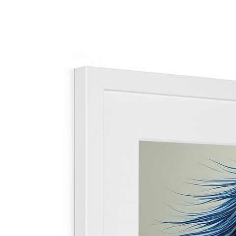 A picture of blue art hanging in a picture frame on a white wall.