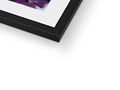 A hard glossy image of a photo on a metal frame lying on top of a book