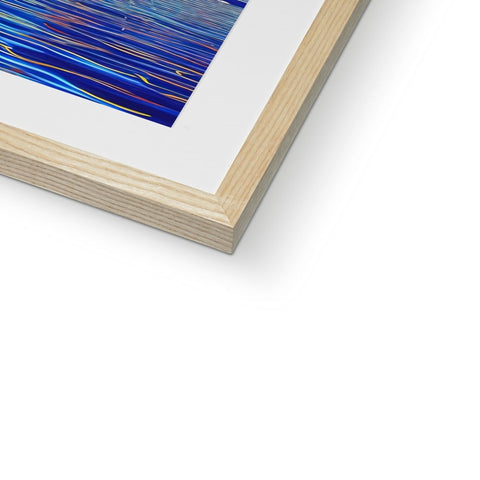 A beautiful photo of an art print on a wood frame in a room in front of