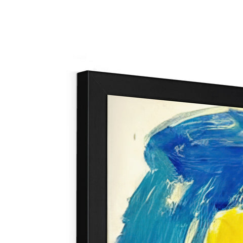 An easel filled with artwork hanging on a wall is sitting underneath a small TV.