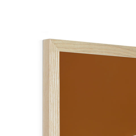 A picture frame with brown paint hanging on it in front of a white background.