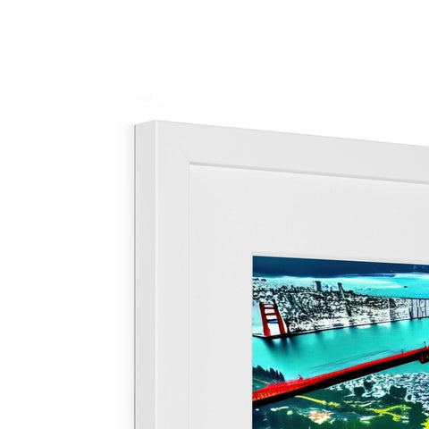 A picture frame with two white pictures in front of a computer monitor.