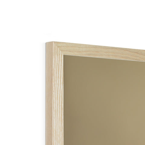 A picture frame holding a pair of wood frames on a white wall.