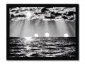 A photo printed artwork of ocean vignettes on a wall with the sun.