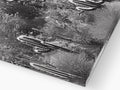 A close up of an unbroken metal plate on plate next to a metal plate of