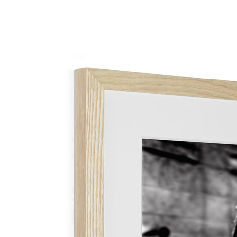 A photograph of wood framed in a white photo frame inside of a wood book.