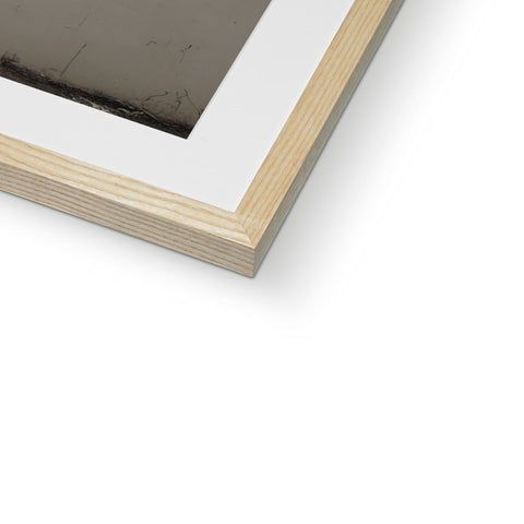 A frame that is on top of a wood frame looking at a picture.