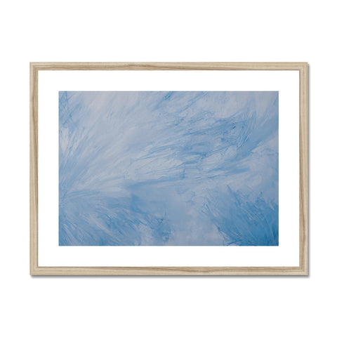 A hanging picture frame with a sky blue painting on a white background.