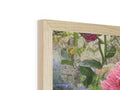a wooden photo frame with a pair of framed pictures inside of it and flowers