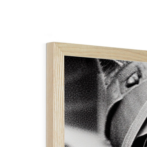 Black and white photo frames stacked to match the inside of a wooden wood frame on a