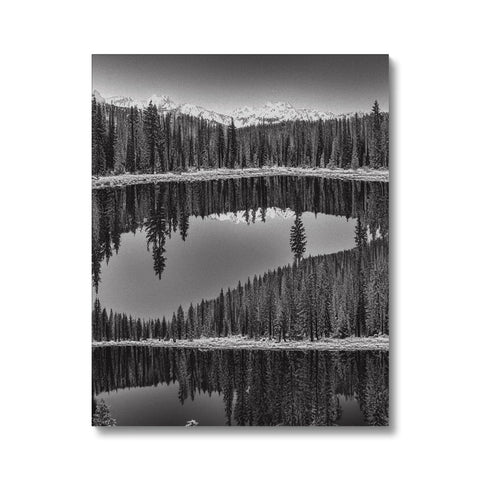 Art print of a snowy lake that is surrounded with trees and snow.