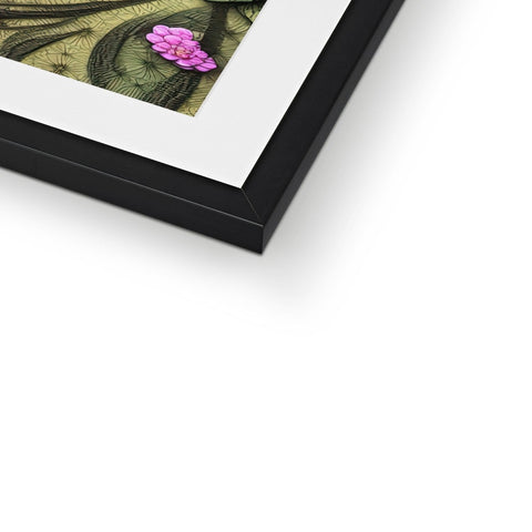 A photo of flowers resting in a frame on top of a black frame.