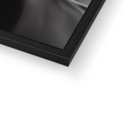 A picture frame with an image hanging over a black bar