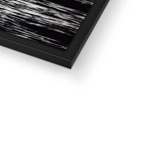 An art print on a glass table has a broken black glass.