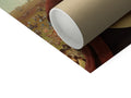A roll of white paper that is sitting on a roll of brown paper.