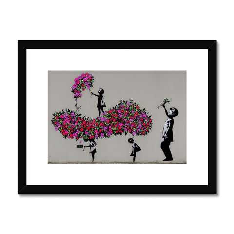 An art print with one of them decorated with flowers.