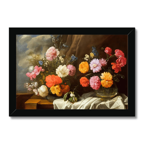 The display of flowers and an art print on the frame is on a table in a