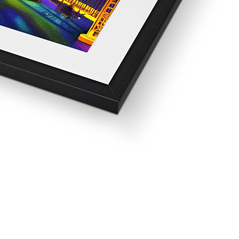 A picture of a picture frame that is in front of a framed print on metal.
