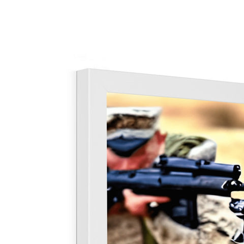 A soldier holding a rifle next to a binder with a picture in it.
