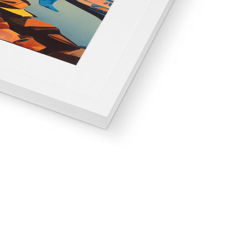 Art print is stacked into a wooden frame on a white table holding a framed picture.