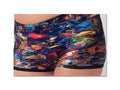a pair of kids' and adults' swim trunks that are on top of them