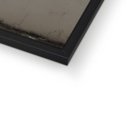 A picture frame sits on top of a piece of metal.