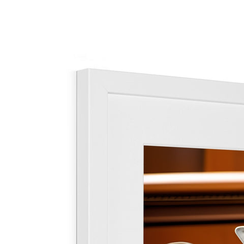 A picture frame holding a mirror next to two small framed white pictures.