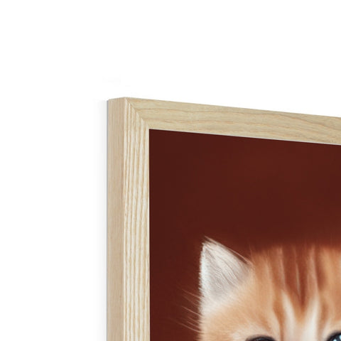 a picture frame in a wooden piece of furniture with a cat peeking up from behind