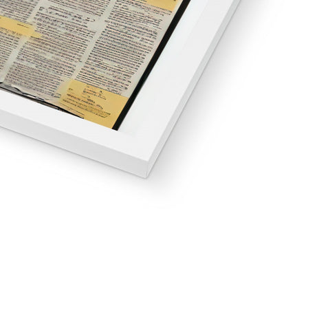 A printable photo of newspaper in a black and white tablet on top of a glass