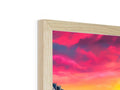 A photo frame that includes wood on it's base in plain view of scenery.