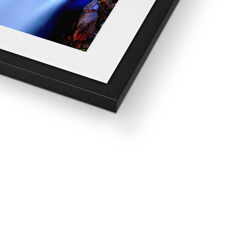 A softcover photo is placed on top of a photo frame.