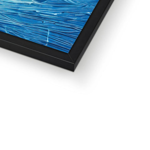 A blue framed picture of a boogie board of ocean spray floating on a wooden frame