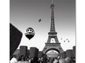 A piece of paper with a paper balloon, stickers and an image of Paris.