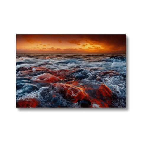 A picture of a red sea with a red sky near a sunset setting.