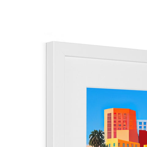 An art print that is framed in a room with some old photos of the city.