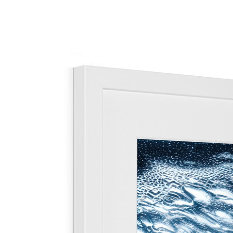 a close up of a framed picture of an iMac tablet in a white room with