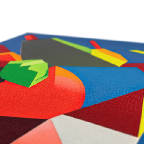 This colorful fold-up square tabletop is lined up with kites that have been