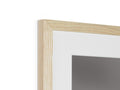 A picture frame with a frame on a wall featuring a mirror with wooden frame.
