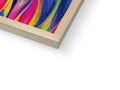 A white and gray framed painting of rainbow feathers on a wooden display board.