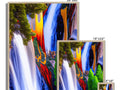 A colorful print framed picture of a waterfall on a wall surrounded by three pictures (all