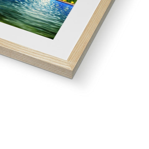 A picture of a white and blue photo in a wooden frame.