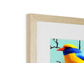 A colorful bird on a wooden screen sitting under a picture in a picture frame.
