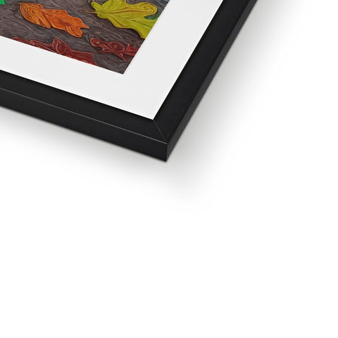 The art print is displayed in a wooden frame sitting on a table.