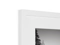 A picture frame that has a frame on it in a white room.