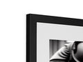 A picture of a picture frame with a computer, black and white image, and another