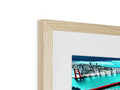 A picture frame with a photo sitting on top of a wooden table. a picture at