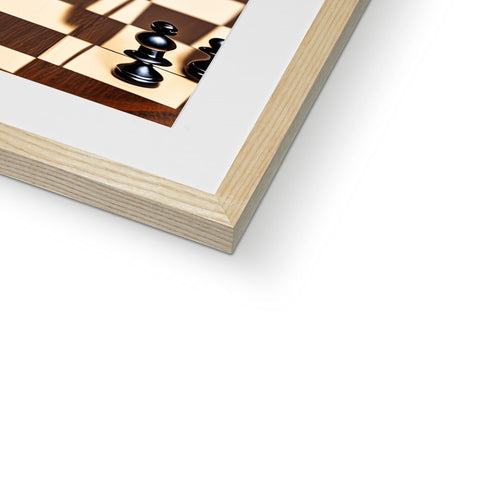 A large wooden framed image of a chess game board with a book and a chessboard