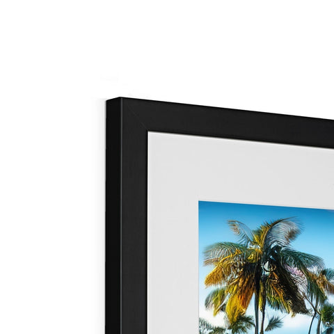 A picture of a black and white photograph is on a black framed picture frame with white