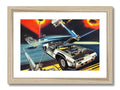 A framed art print of an aerial view of a vehicle on a wooden counter.