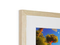 A picture of beautiful artwork on a framed image of a building with trees.